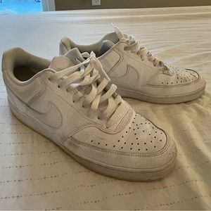 Men’s white leather Nike shoes size 8.5.
